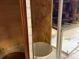 a thermometer on a shelf in a kitchen