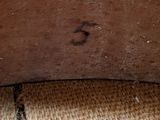 a close up of a piece of wood on the floor