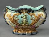 a large vase with a dog on it on a stand