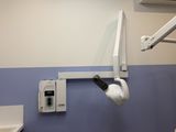an image of a dentist ' s room with a sink and a mirror