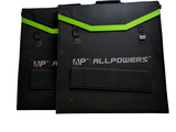 two black bags with green straps on each of them