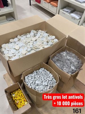 many boxes of coins sitting on the floor in a store