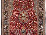 a red rug with a floral design on a white background