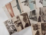 a lot of old postcards that are on a table