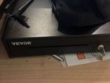 a black hat sitting on top of a black box