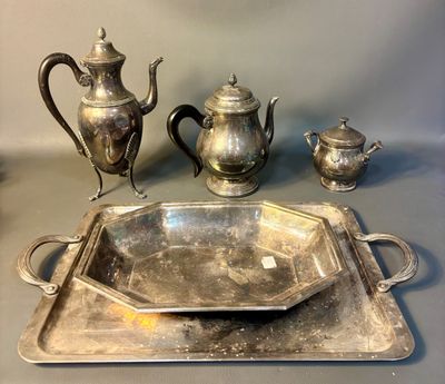 a silver tray with a silver tea pot and a silver tray with a silver tea pot and a silver tray with a silver tea pot and a silver tray