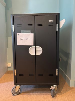 a black locker with a lot of labels on it