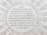 a picture of a silver plate with writing on it