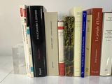 a lot of books that are sitting on a table
