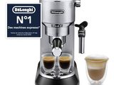 a close up of a coffee machine with two cups of coffee
