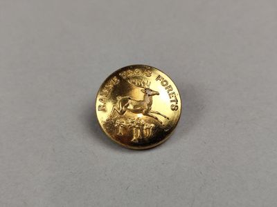 a close up of a gold coin with a man ' s face on it