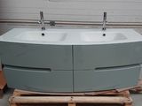 two sinks sitting on top of a pallet in front of a refrigerator