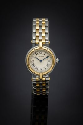 an image of a woman ' s wrist watch on a black surface