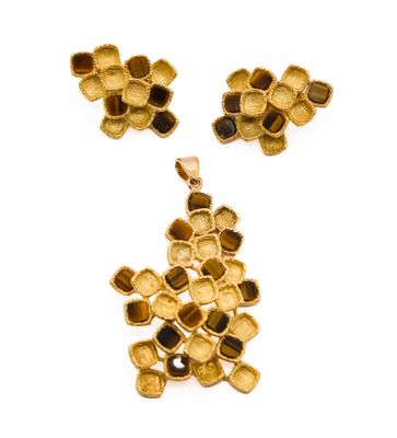 an image of a gold plated necklace and earring set on a white background