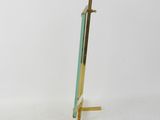 an image of a gold and blue easel on a white background