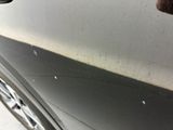 a close up of a car ' s door handle and door handle