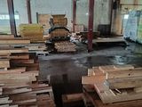 many pieces of wood stacked on top of each other in a warehouse