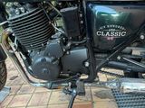 a motorcycle that is parked on the side of the street