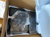 a box with a phone inside of it on a table