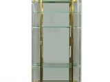 an antique display case with glass shelves and brass trims
