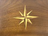 a wooden box with a gold star on it