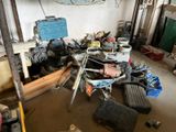 a garage with a lot of tools and tools on the floor