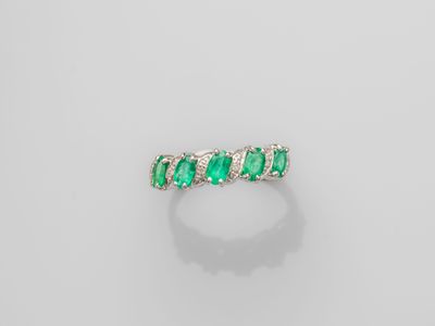 an emerald and diamond ring