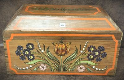 an image of a wooden box with flowers painted on it