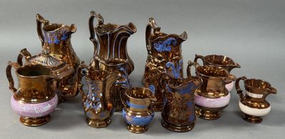 a lot of vases that are sitting on a table