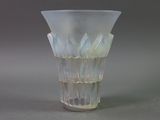 a glass vase that is sitting on a table