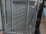 a small cart with a computer on it in a room