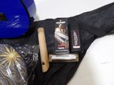 a blue bag and a pair of shoes and a pair of baseball gloves
