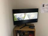 a television that is sitting on top of a shelf