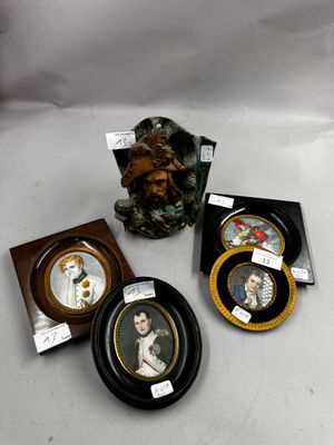 three framed pictures of a woman and a man are on a table