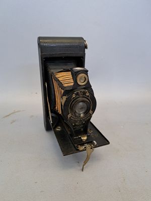 an old camera that is sitting on a table