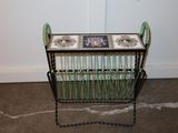 a small table with a basket on it in the corner of a room