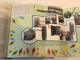 an open book with a picture of a train on it