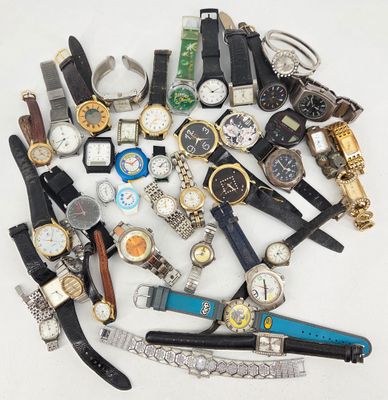 many different types of watches on a white surface