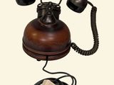 an old fashioned telephone with a cord attached to it