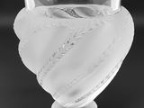 black and white photograph of a glass vase with a heart on it