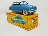 a blue toy car sitting on top of a yellow box