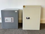 two safe boxes sitting next to each other on the floor