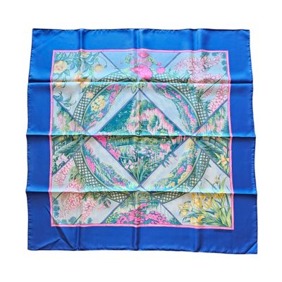 a blue and pink square scarf with a floral design