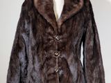 a close up of a fur jacket on a mannequin dummy