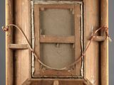 an old wooden easel with an open box on top of it