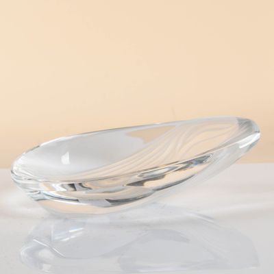 a glass bowl that is sitting on a table