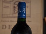 a bottle of wine that is sitting on a table