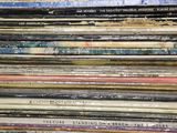 a lot of cds stacked on top of each other