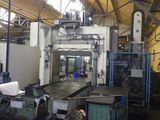 a picture of a machine shop with a large machine in the background