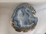 a picture of a piece of agate on a white surface